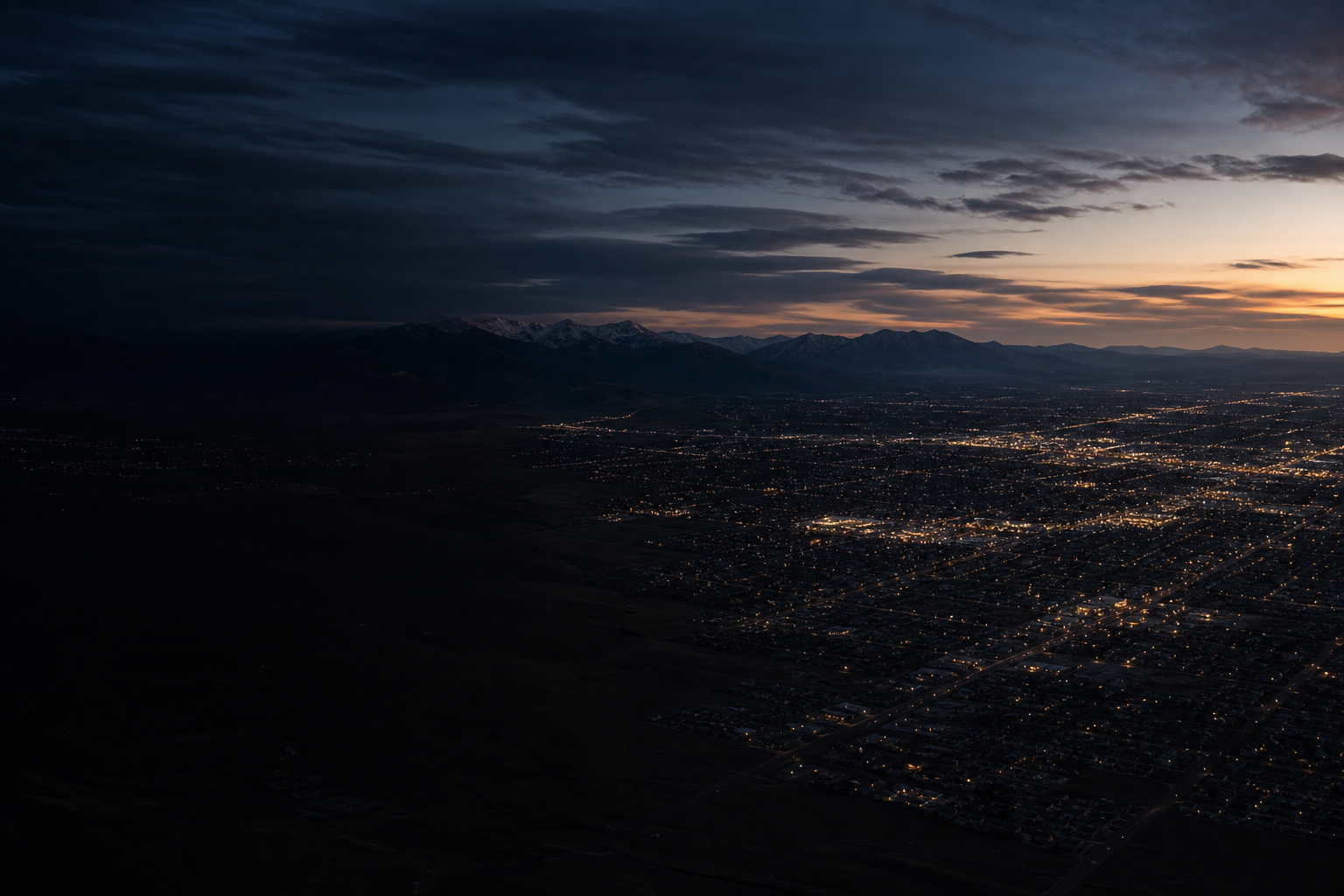 An original blue-hour aerial photograph of a fictional mountain market